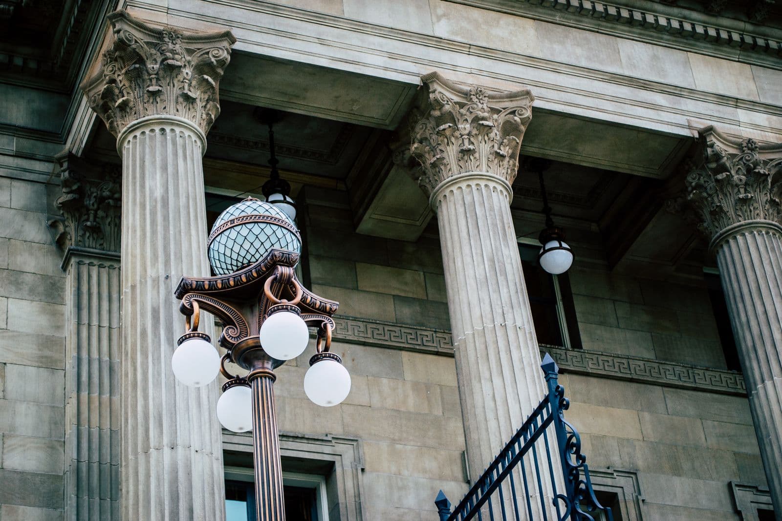 Neoclassical courthouse facade with tall stone justice columns