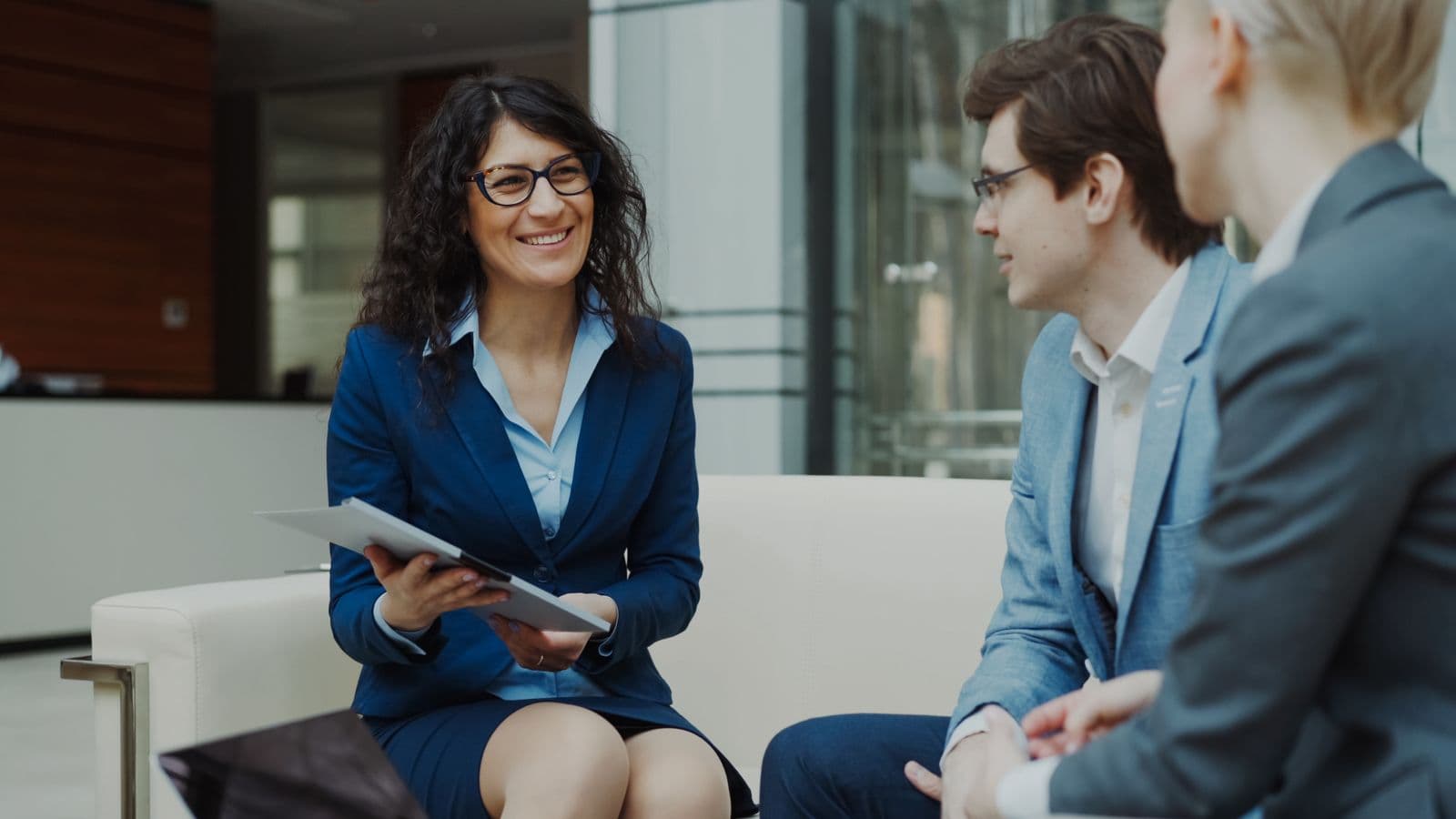 Diverse business consulting team discussing a project around a table